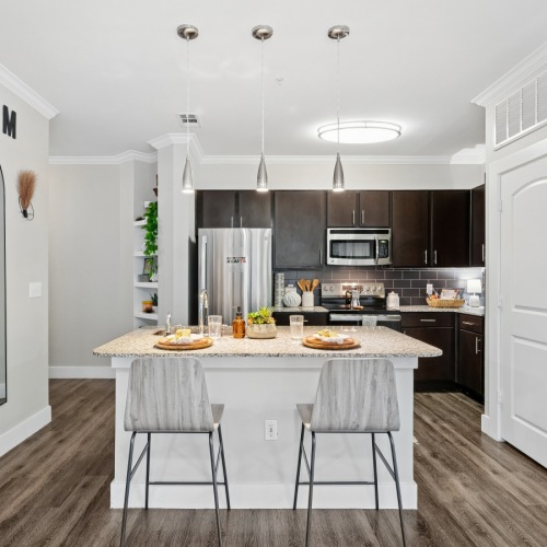 a kitchen with a refrigerator and microwave