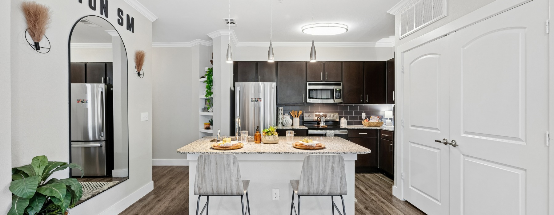 a kitchen with seating and decor