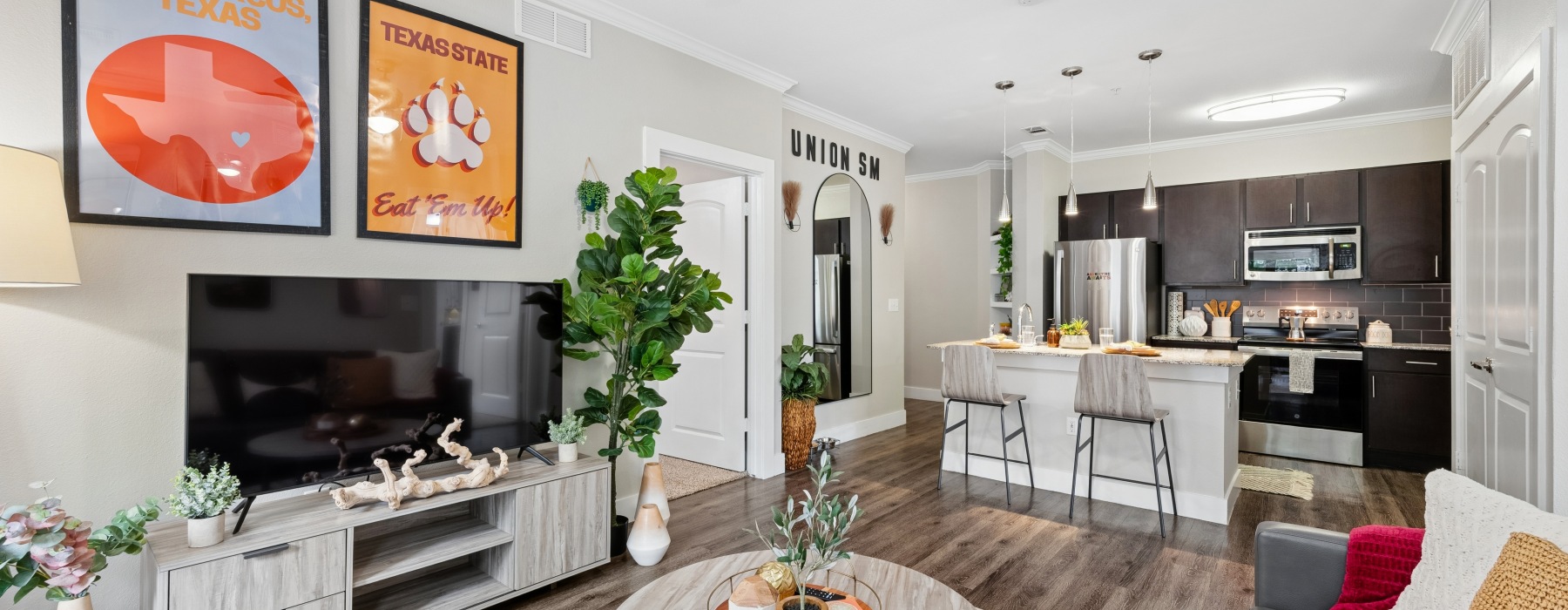 kitchen with ample counter-space, modern appliances and bright lighting