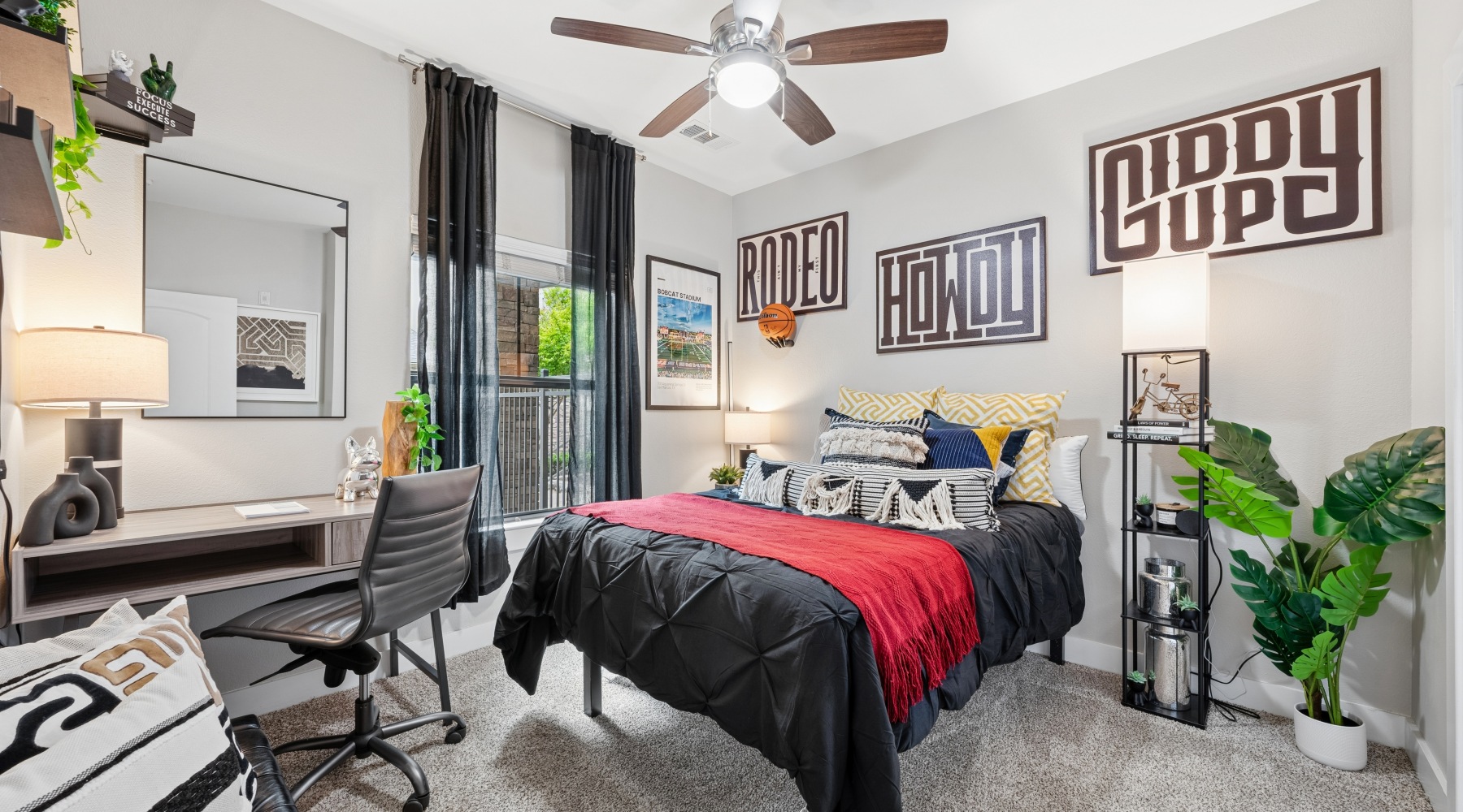 a bedroom with a bed and a desk