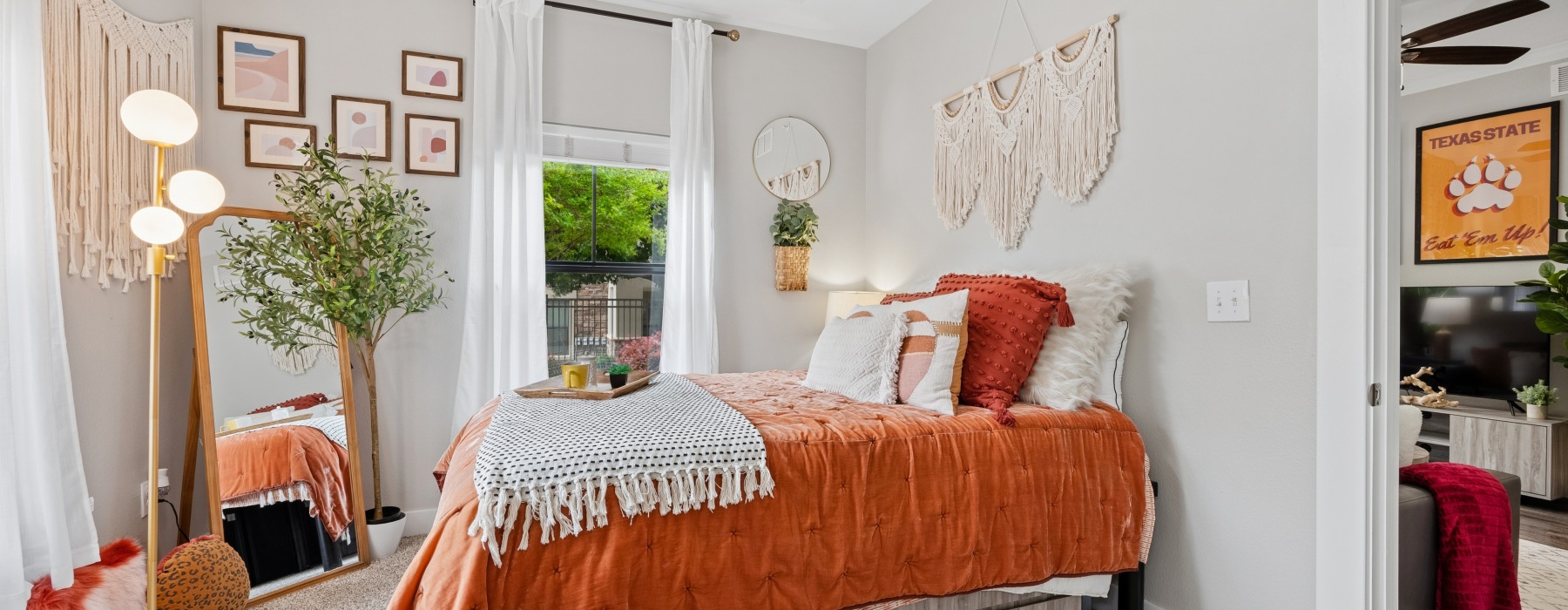 a bedroom with a bed and a desk