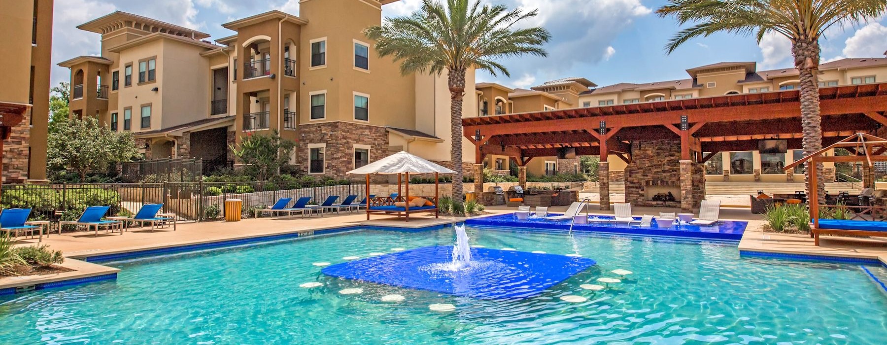 a swimming pool in front of a building